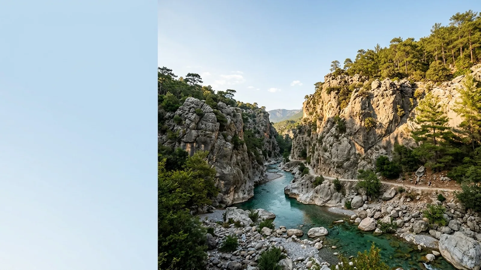 Goynuk, Türkiye — the Goynuk valley near Kemer, a narrow limestone canyon with clear green water running between high rock walls, pine trees along the rim.