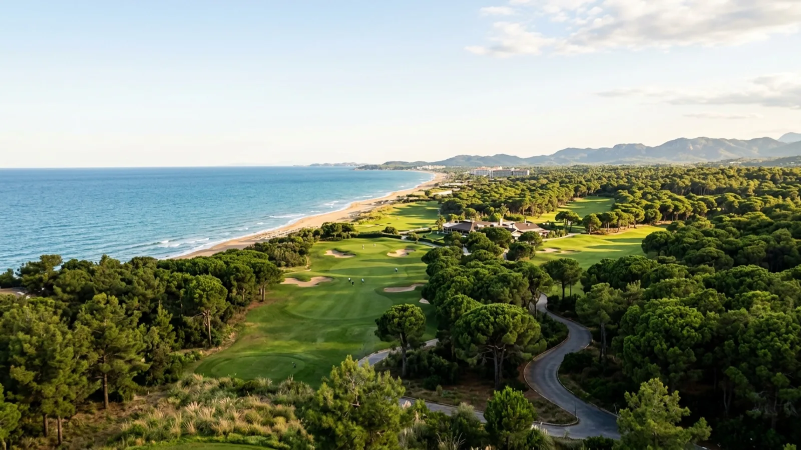 Kadriye, Türkiye — the countryside around Kadriye near Belek, green golf fairways and pine woods between the resort area and the sandy coastline.