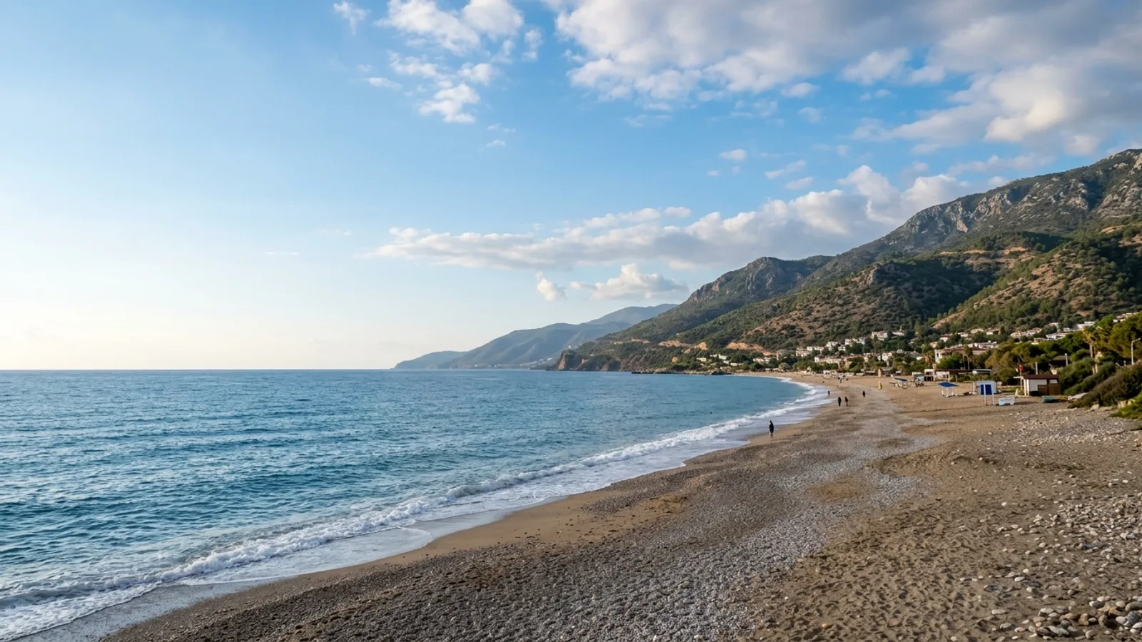 Payallar, Türkiye — the coastline at Payallar west of Alanya, a sand and shingle beach with the Taurus foothills close behind.