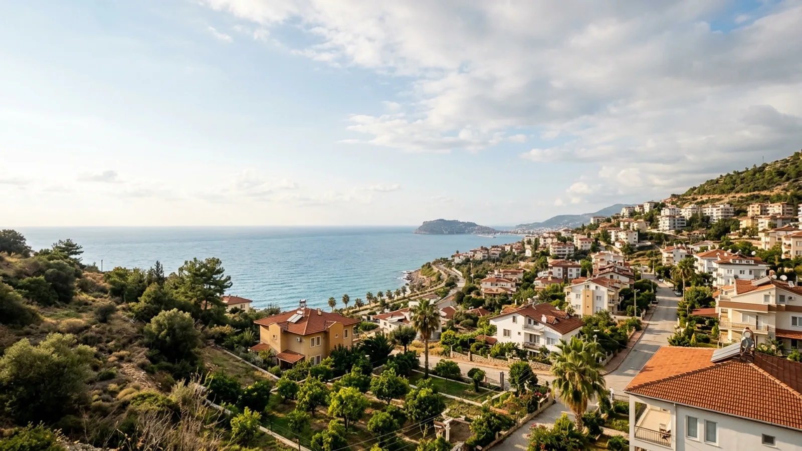 Oba, Türkiye — the Oba district on the eastern edge of Alanya, low-rise residential streets and citrus gardens on a hillside above the sea.